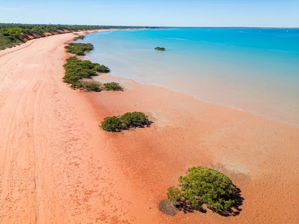 Red beach, blue ocean