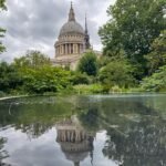 Large cathedral in background, reflection of cathedral in large pond