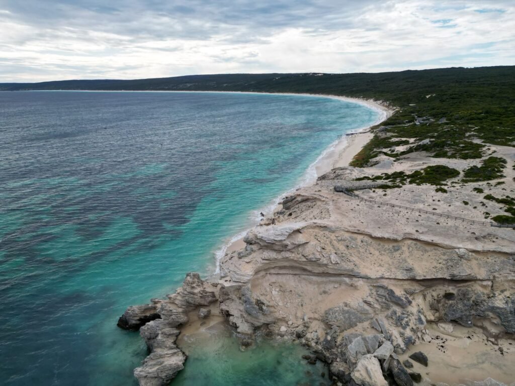 Drone photo, limestone cliffs, bright blue ocean along cliffline