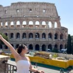 Girl in white dress in front of Colosseum of Rome