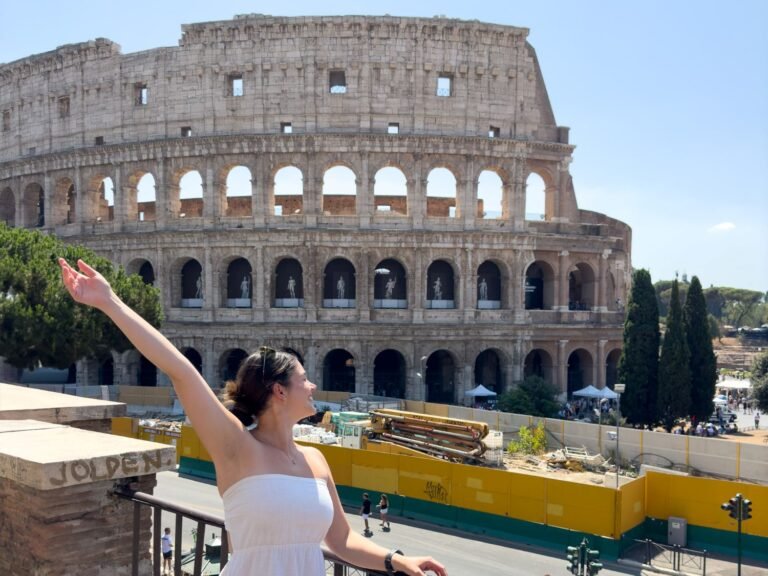 Girl in white dress in front of Colosseum of Rome