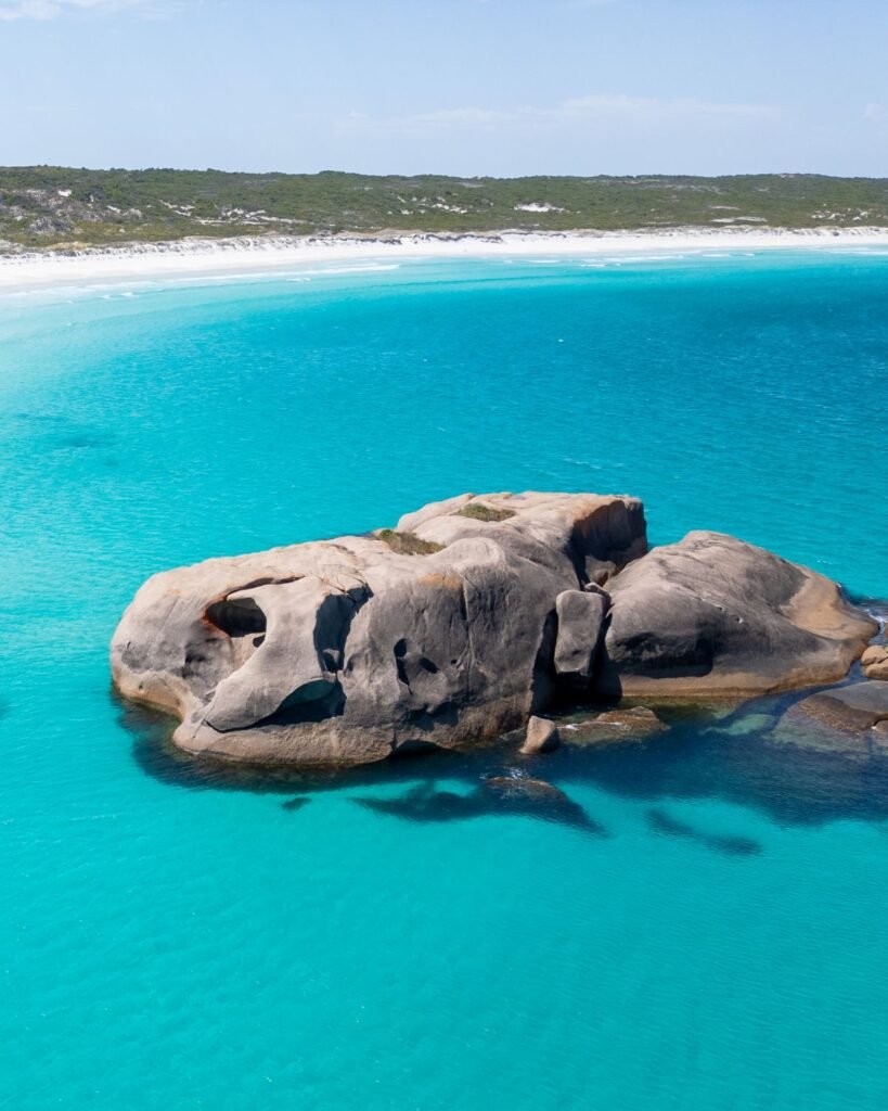Esperance Twilight Beach, crystal clear water surrounding large rock, Perth road trips